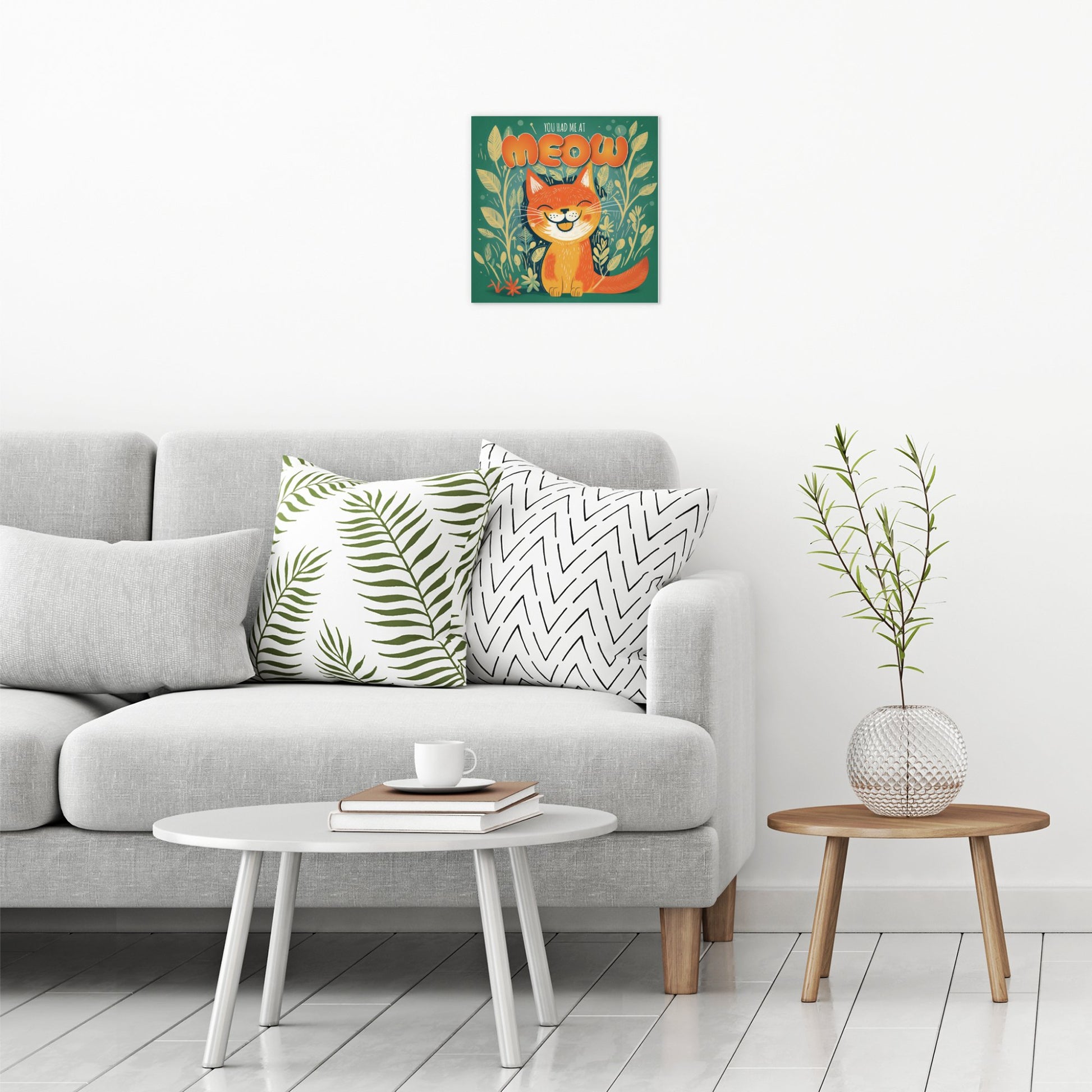 A contemporary modern room view showing a medium size metal art poster display plate with printed design of a You Had Me At Meow - Cute Cat Quote
