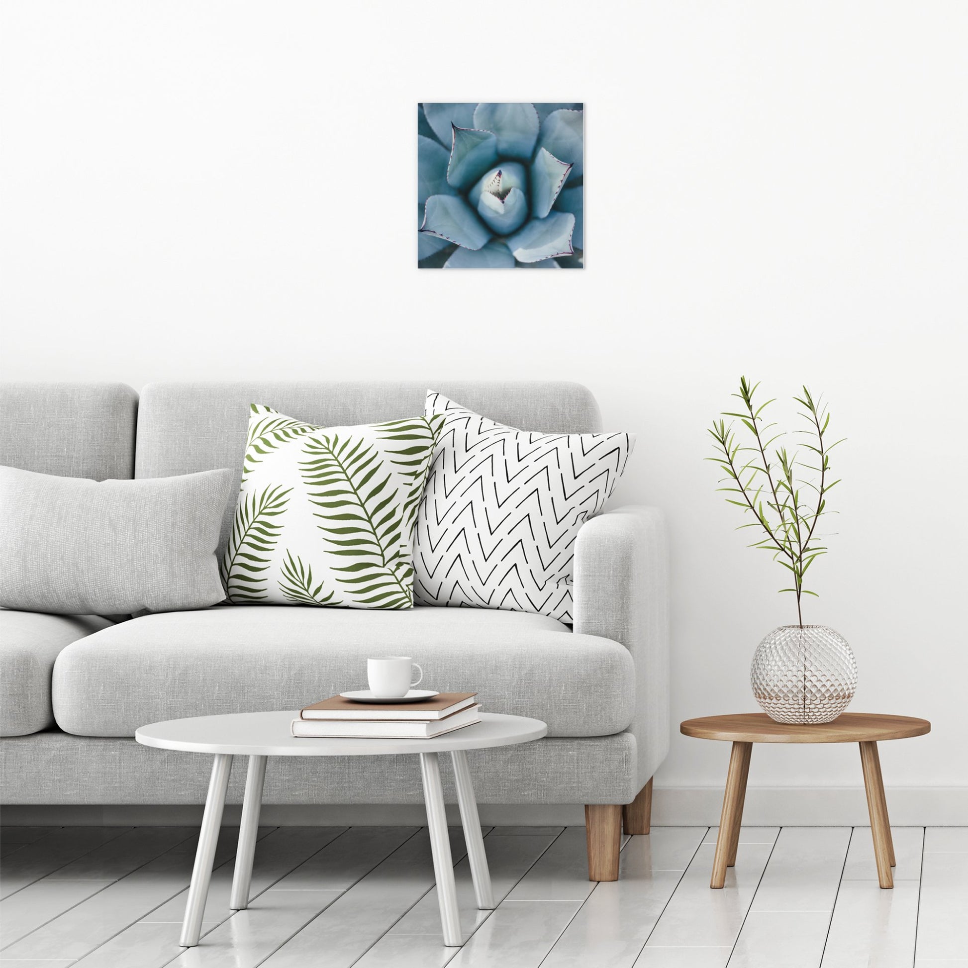 A contemporary modern room view showing a medium size metal art poster display plate with printed design of a Blue Succulent