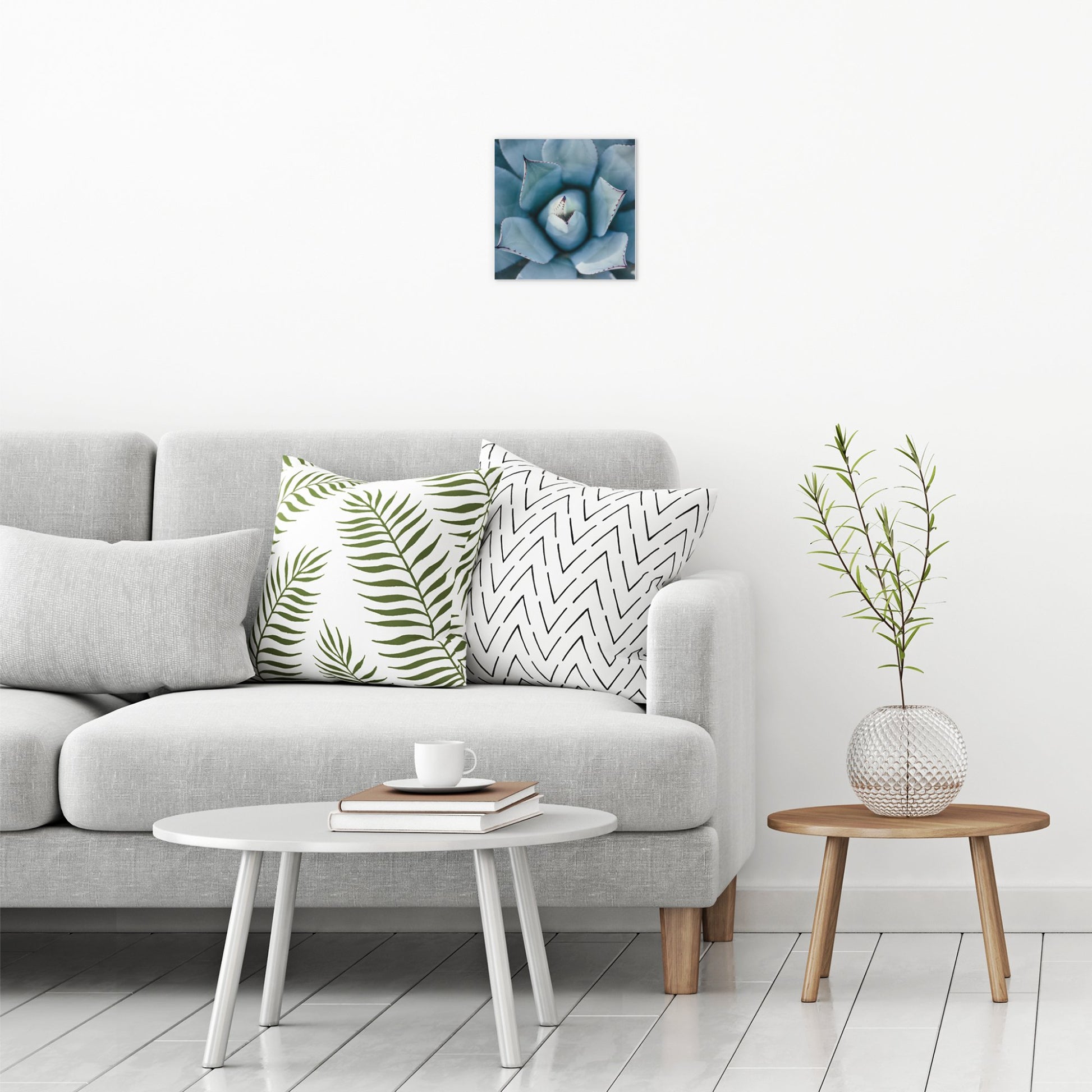 A contemporary modern room view showing a small size metal art poster display plate with printed design of a Blue Succulent