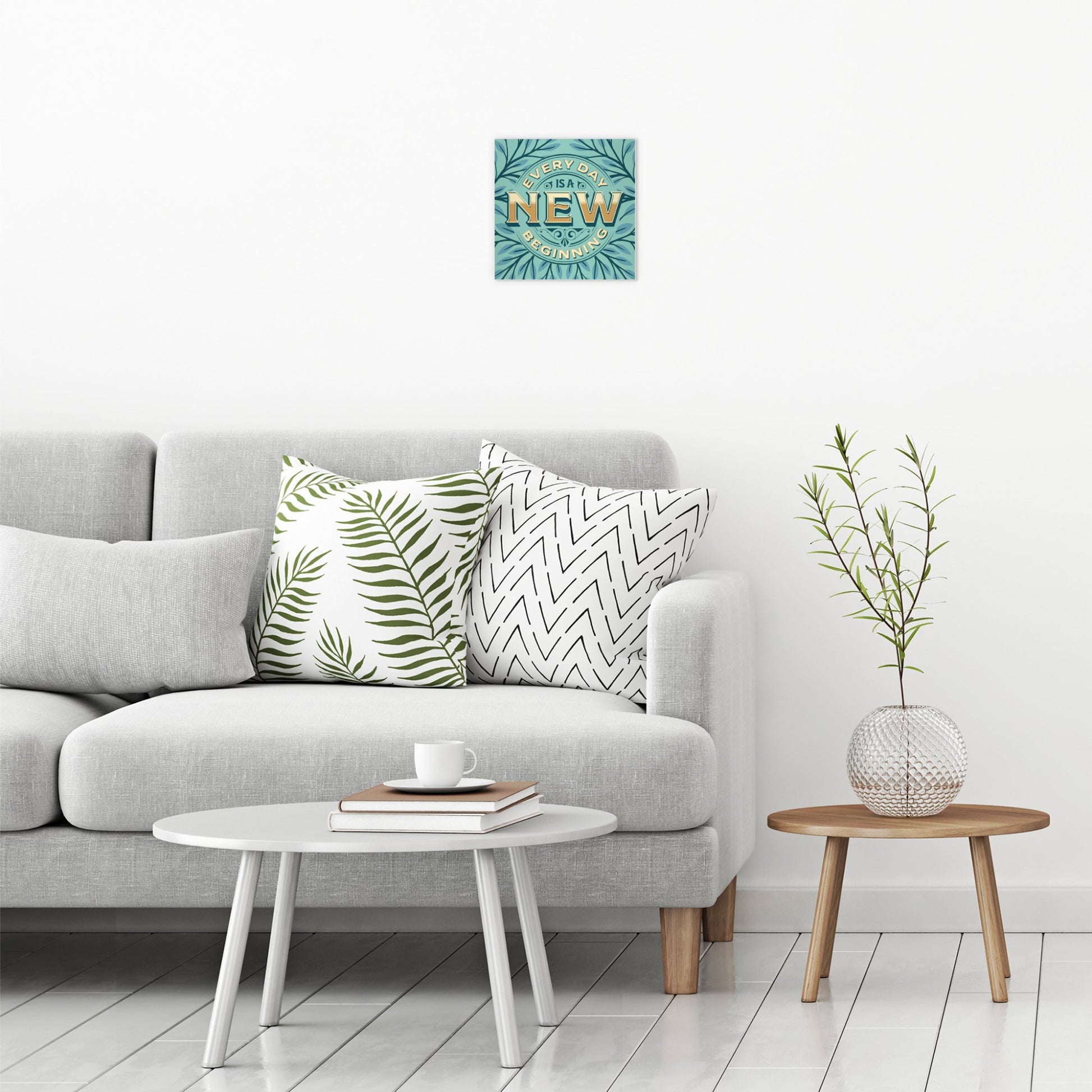 A contemporary modern room view showing a small size metal art poster display plate with printed design of a Every Day is A New Beginning Quote
