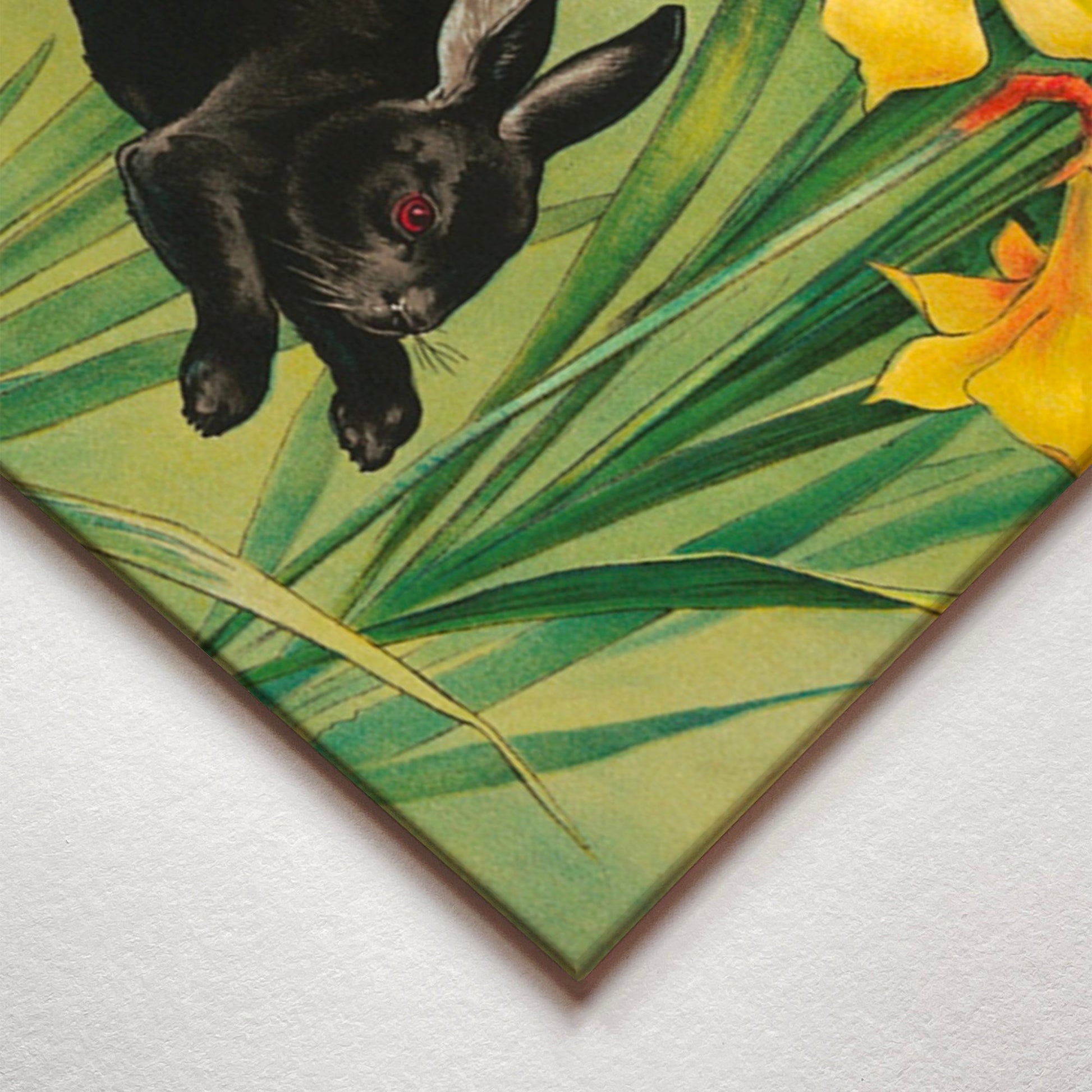 A closeup corner detail view of a metal art poster display plate with printed design of a Bunnies and Daffodils Vintage Illustration