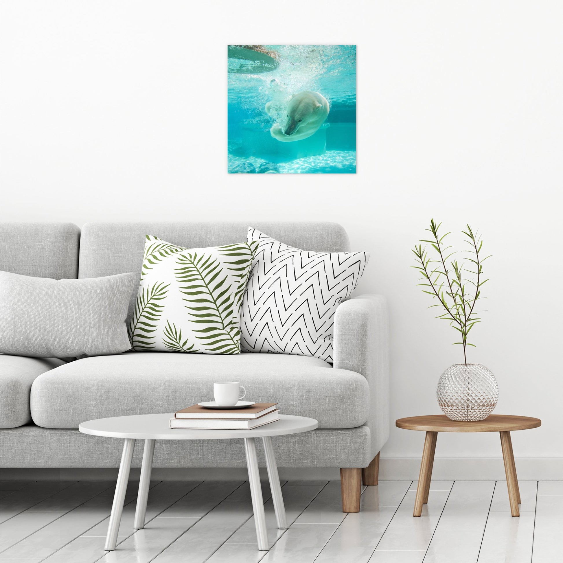 A contemporary modern room view showing a large size metal art poster display plate with printed design of a Polar Bear Under Water