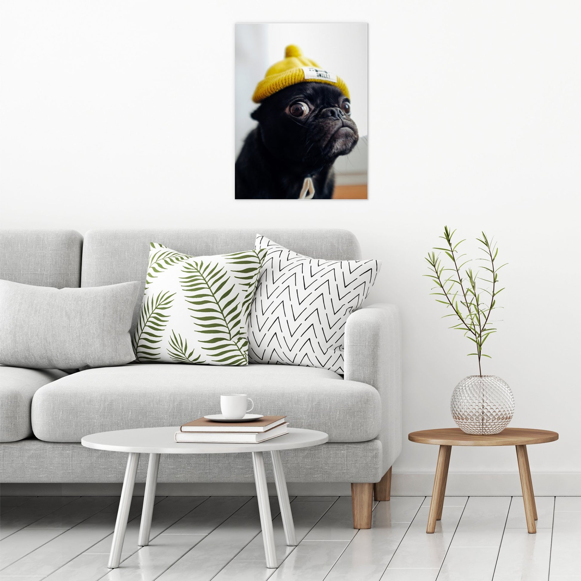 A contemporary modern room view showing a large size metal art poster display plate with printed design of a Pug in a Yellow Hat