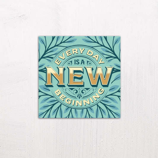 A medium size metal art poster display plate with printed design of a Every Day is A New Beginning Quote