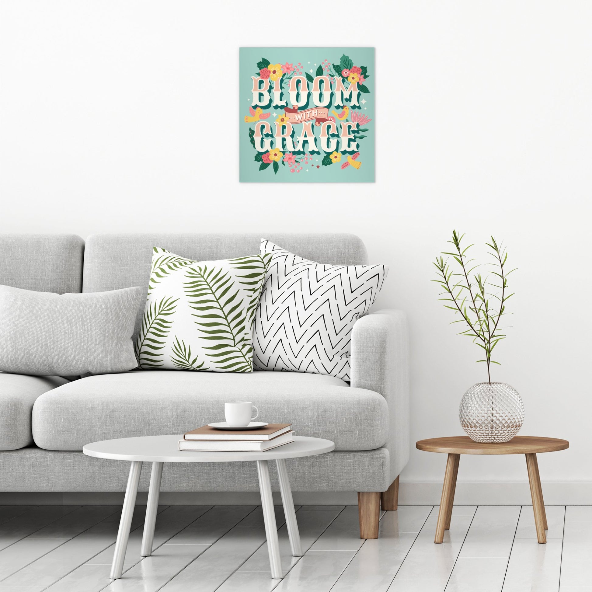 A contemporary modern room view showing a large size metal art poster display plate with printed design of a Bloom with Grace Inspirational Quote