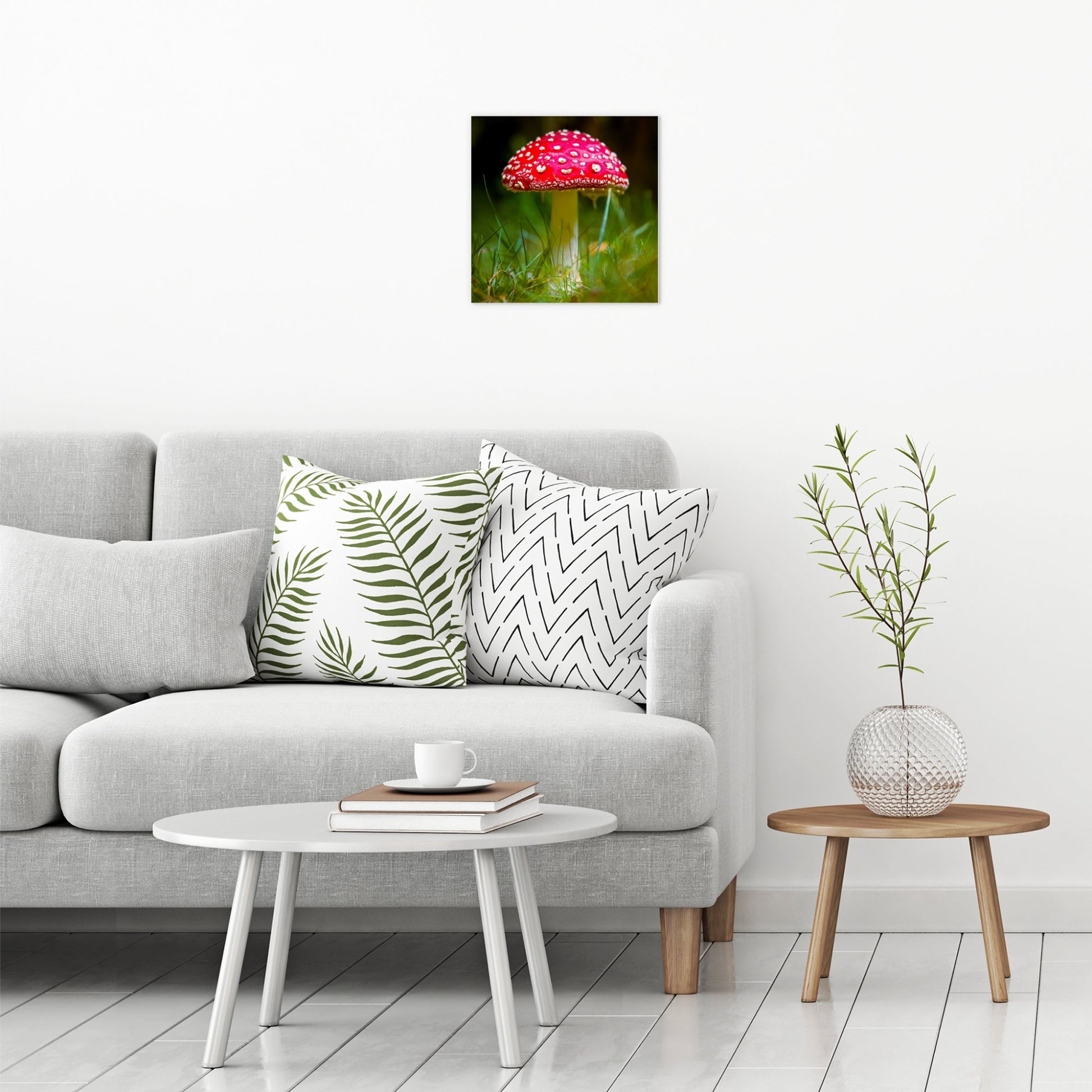 A contemporary modern room view showing a medium size metal art poster display plate with printed design of a Fly Agaric (Amanita muscaria) Fungi