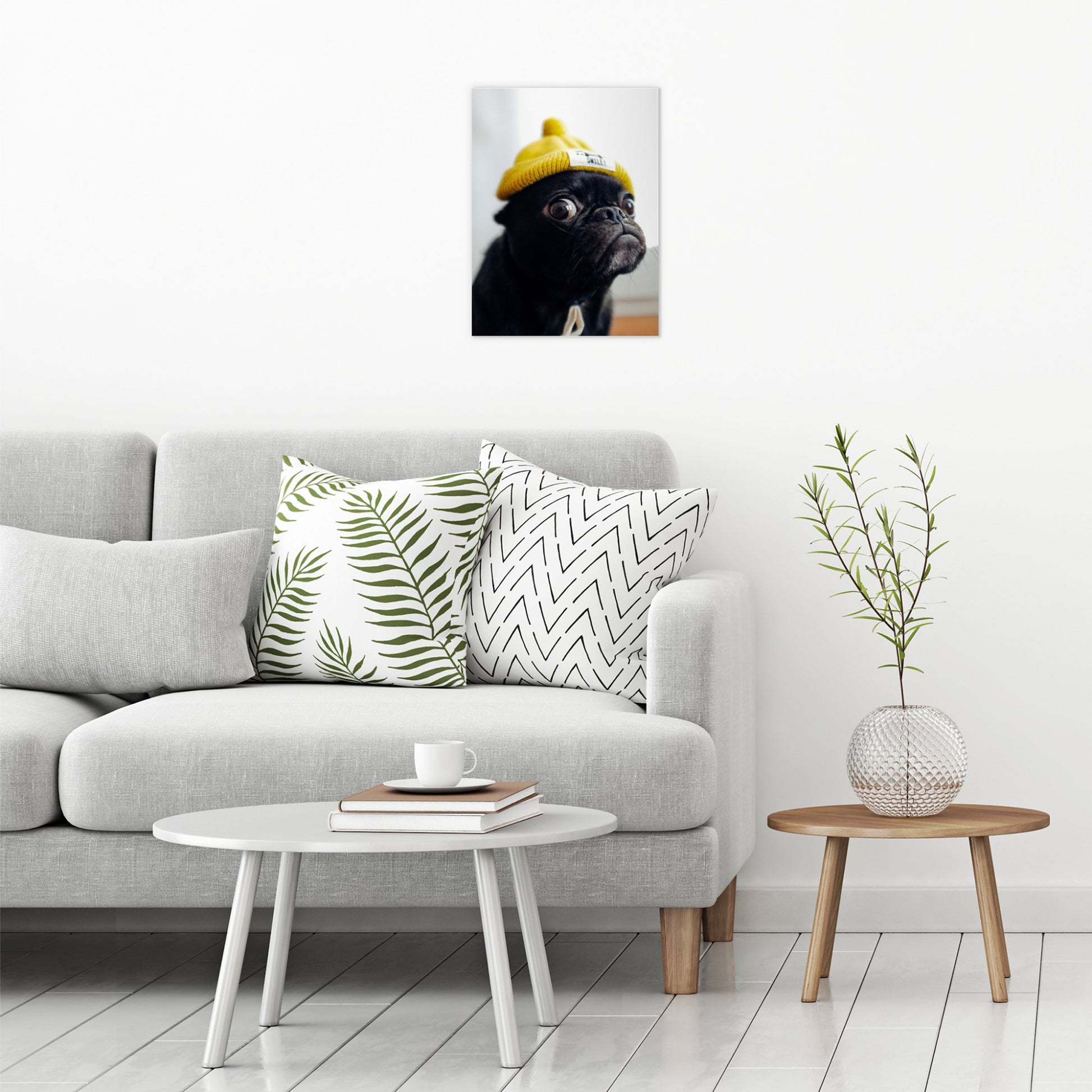 A contemporary modern room view showing a medium size metal art poster display plate with printed design of a Pug in a Yellow Hat