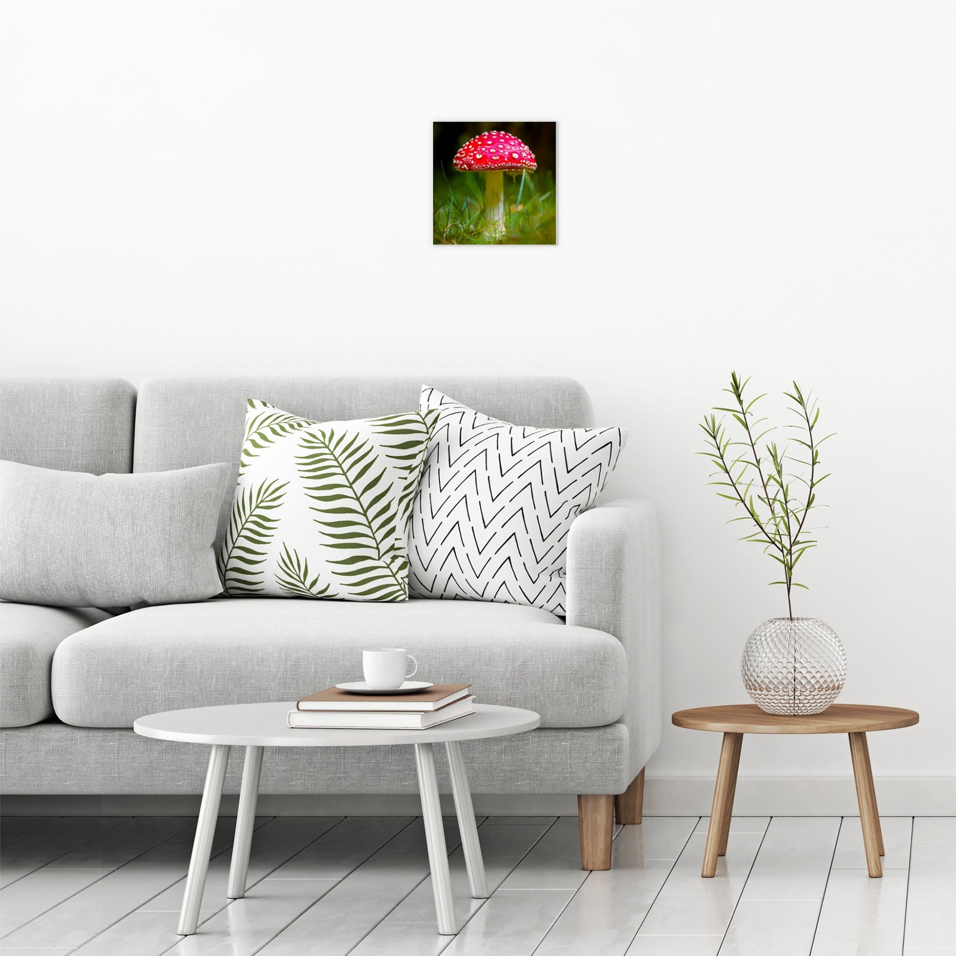 A contemporary modern room view showing a small size metal art poster display plate with printed design of a Fly Agaric (Amanita muscaria) Fungi