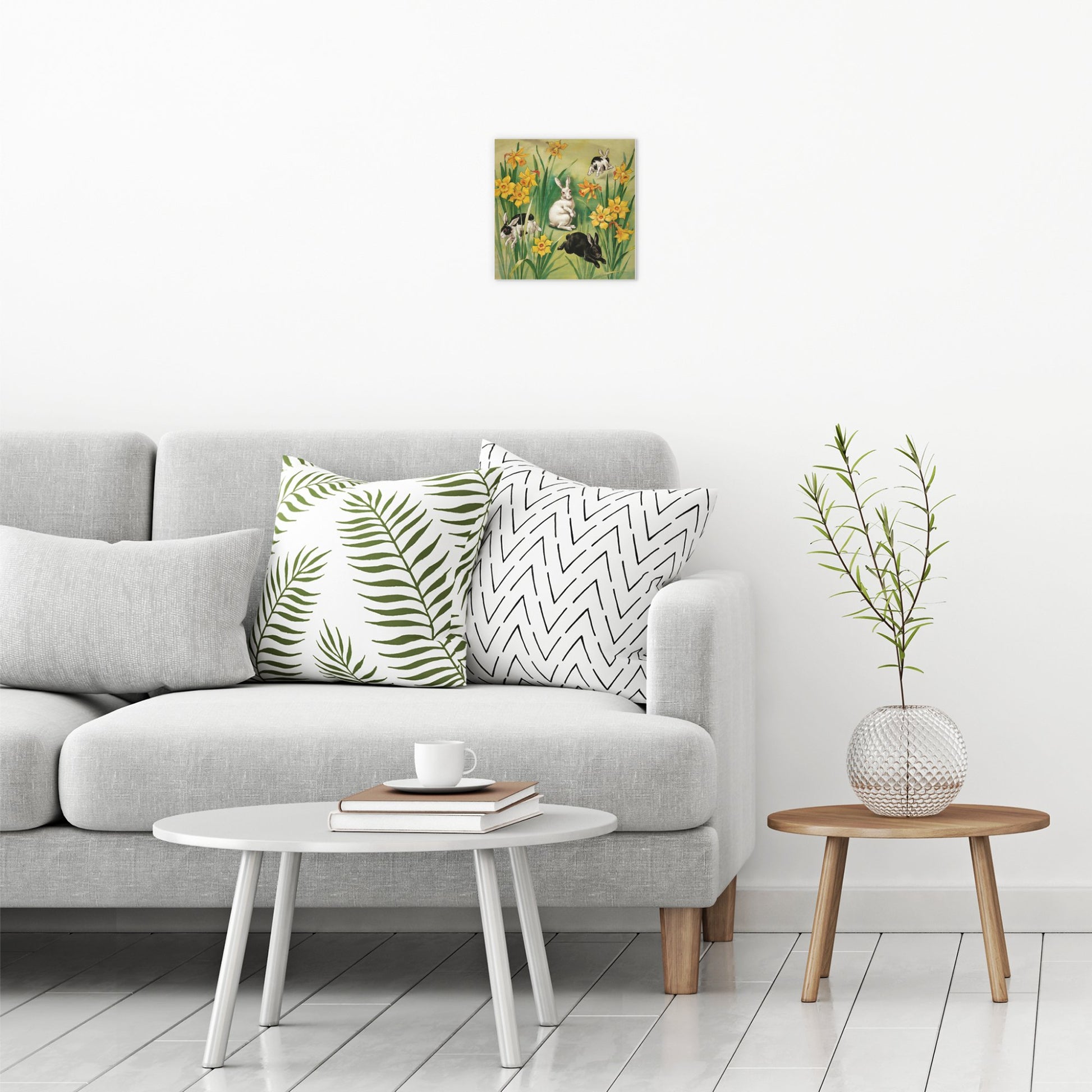 A contemporary modern room view showing a small size metal art poster display plate with printed design of a Bunnies and Daffodils Vintage Illustration