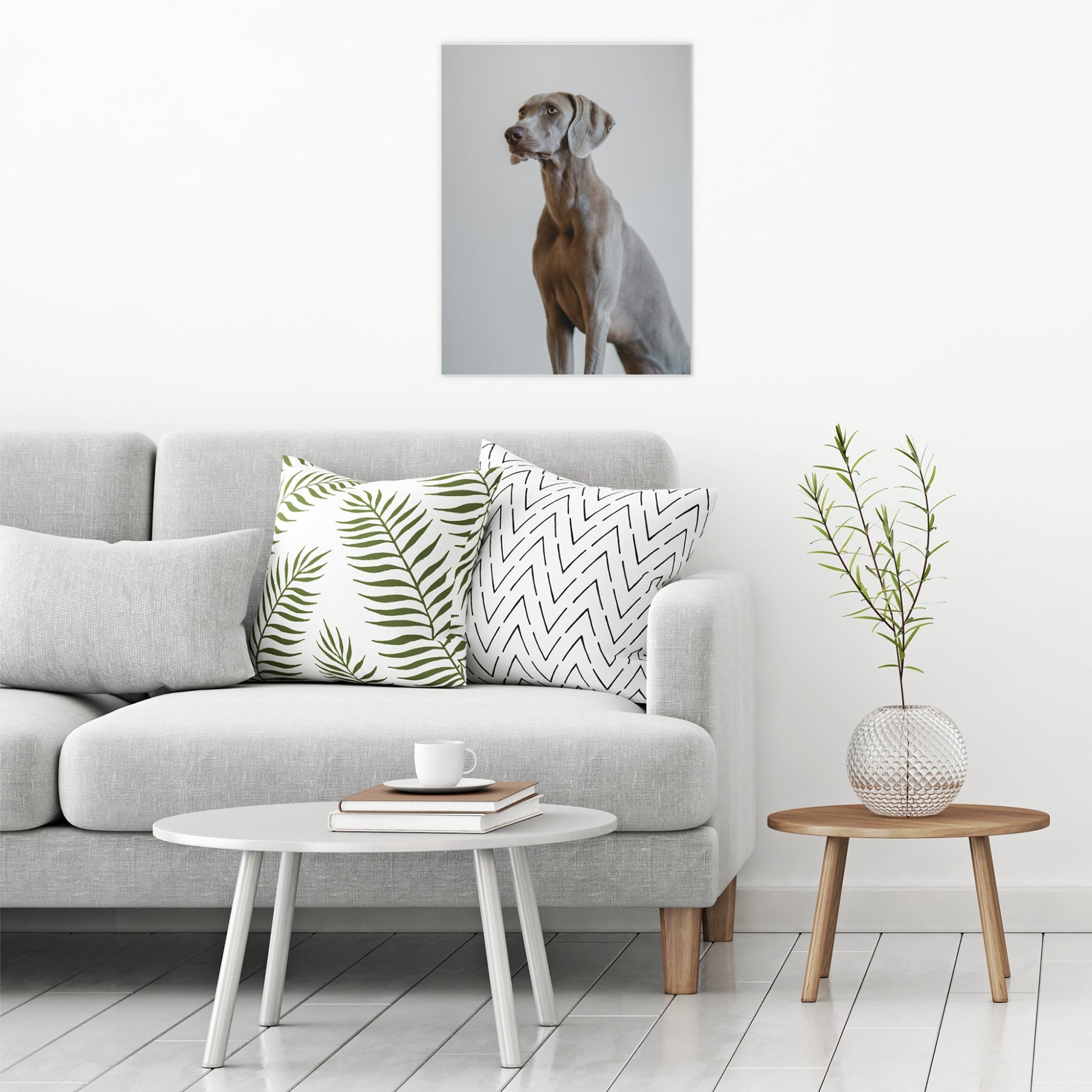 A contemporary modern room view showing a large size metal art poster display plate with printed design of a Weimaraner