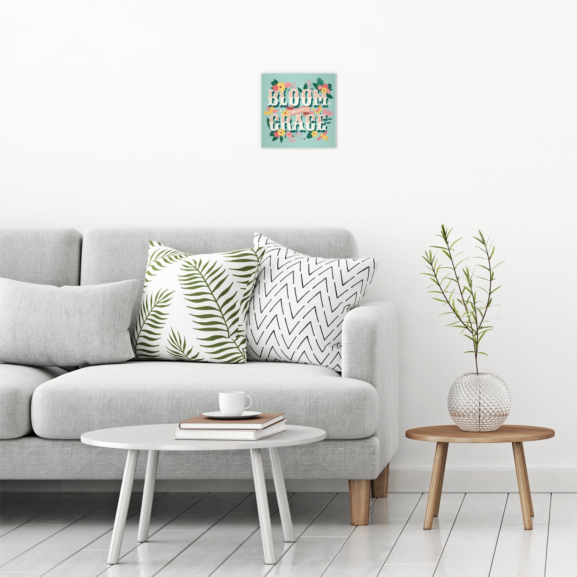 A contemporary modern room view showing a small size metal art poster display plate with printed design of a Bloom with Grace Inspirational Quote