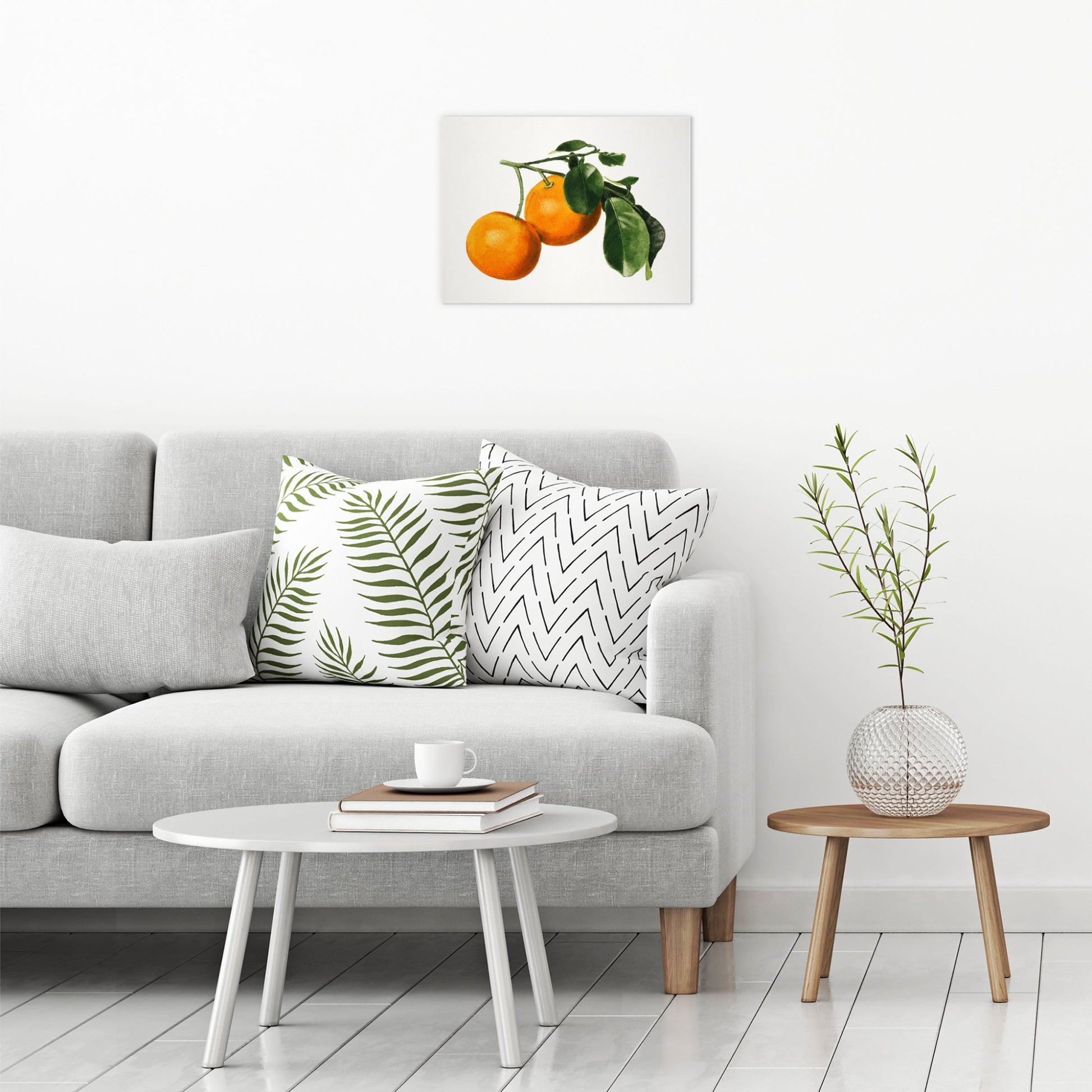A contemporary modern room view showing a medium size metal art poster display plate with printed design of a Vintage Watercolour Illustration of Oranges