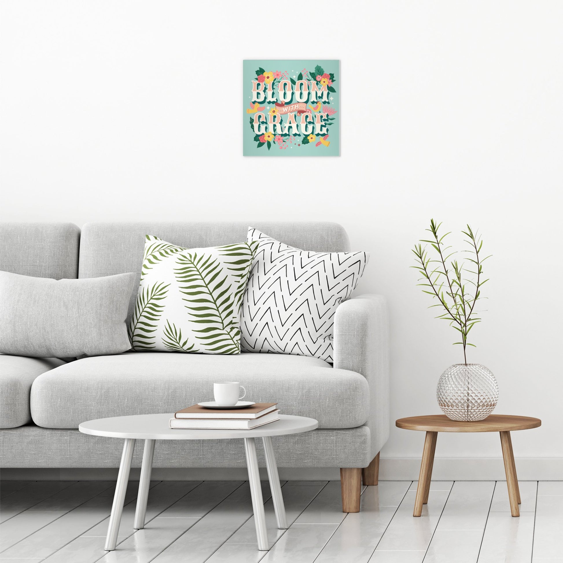 A contemporary modern room view showing a medium size metal art poster display plate with printed design of a Bloom with Grace Inspirational Quote
