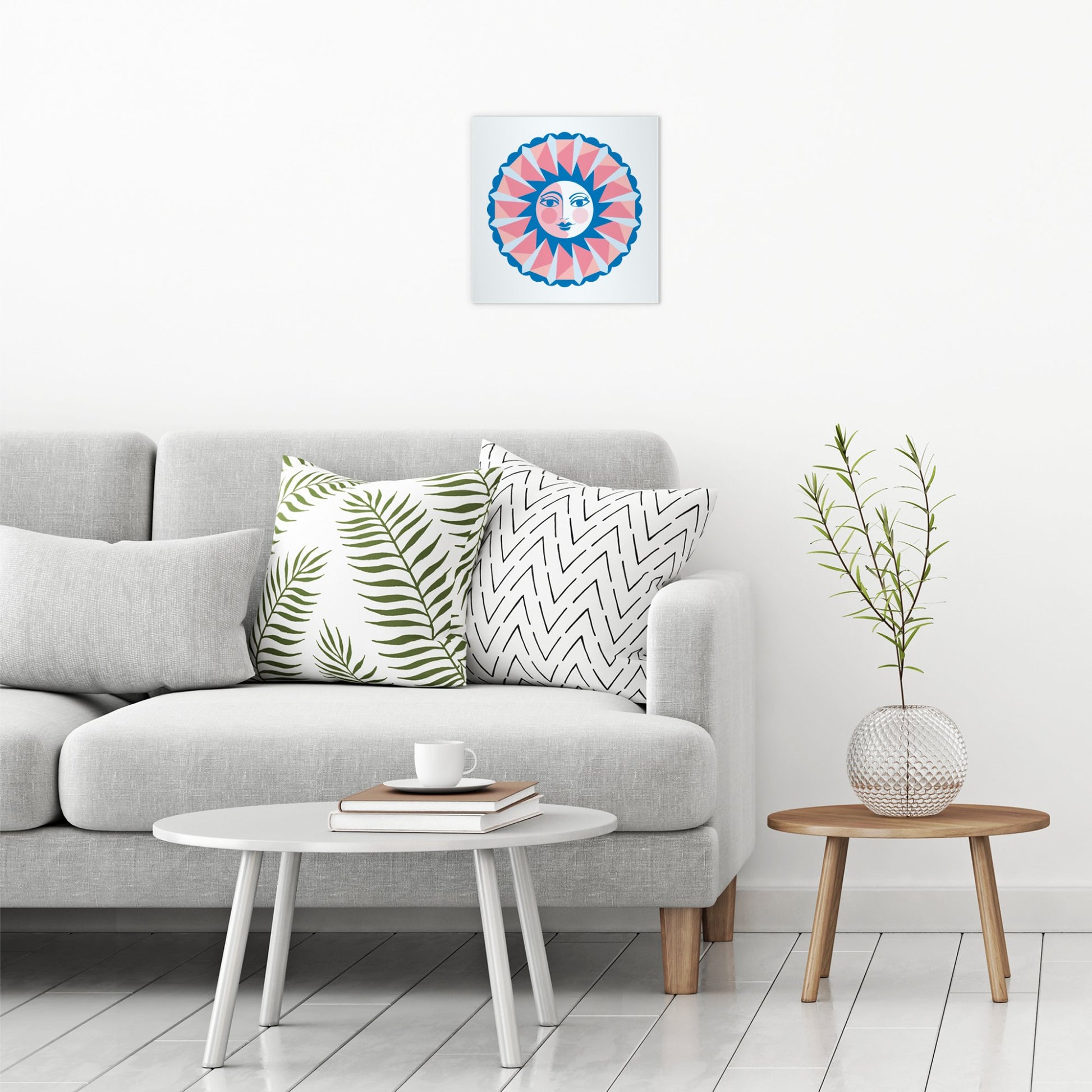 A contemporary modern room view showing a medium size metal art poster display plate with printed design of a Sun Face Design