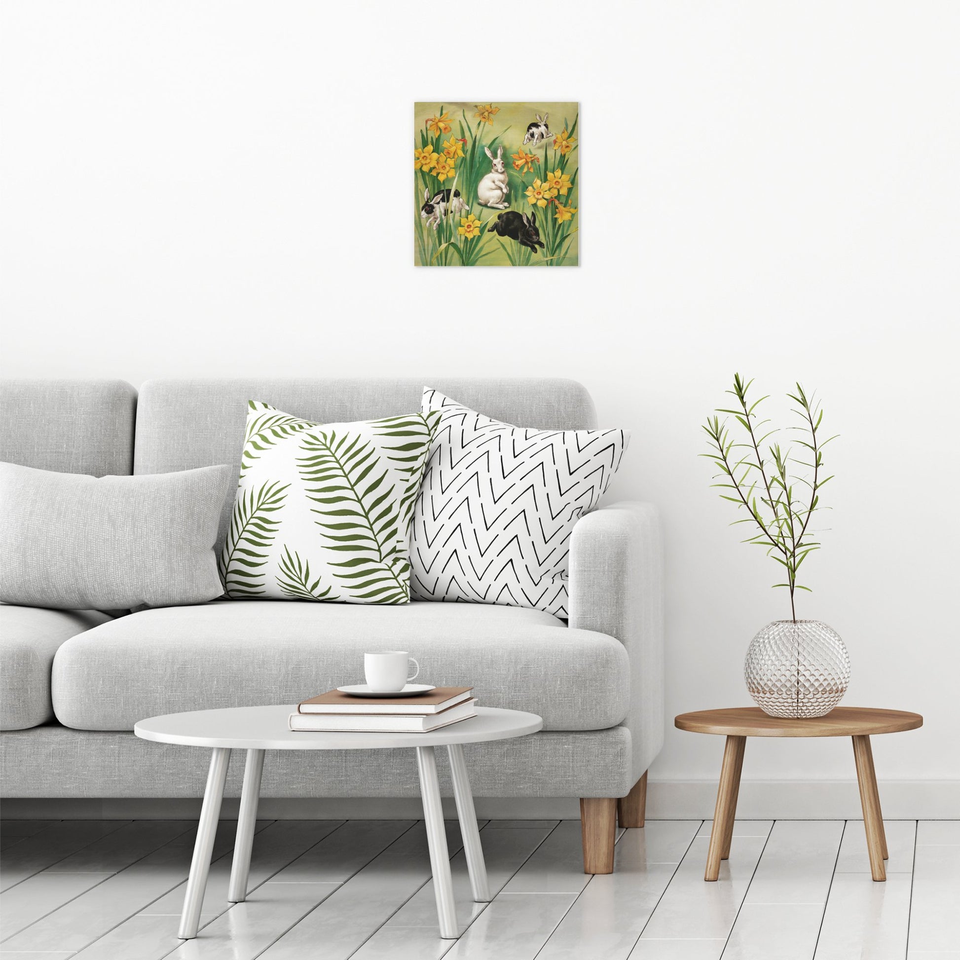 A contemporary modern room view showing a medium size metal art poster display plate with printed design of a Bunnies and Daffodils Vintage Illustration