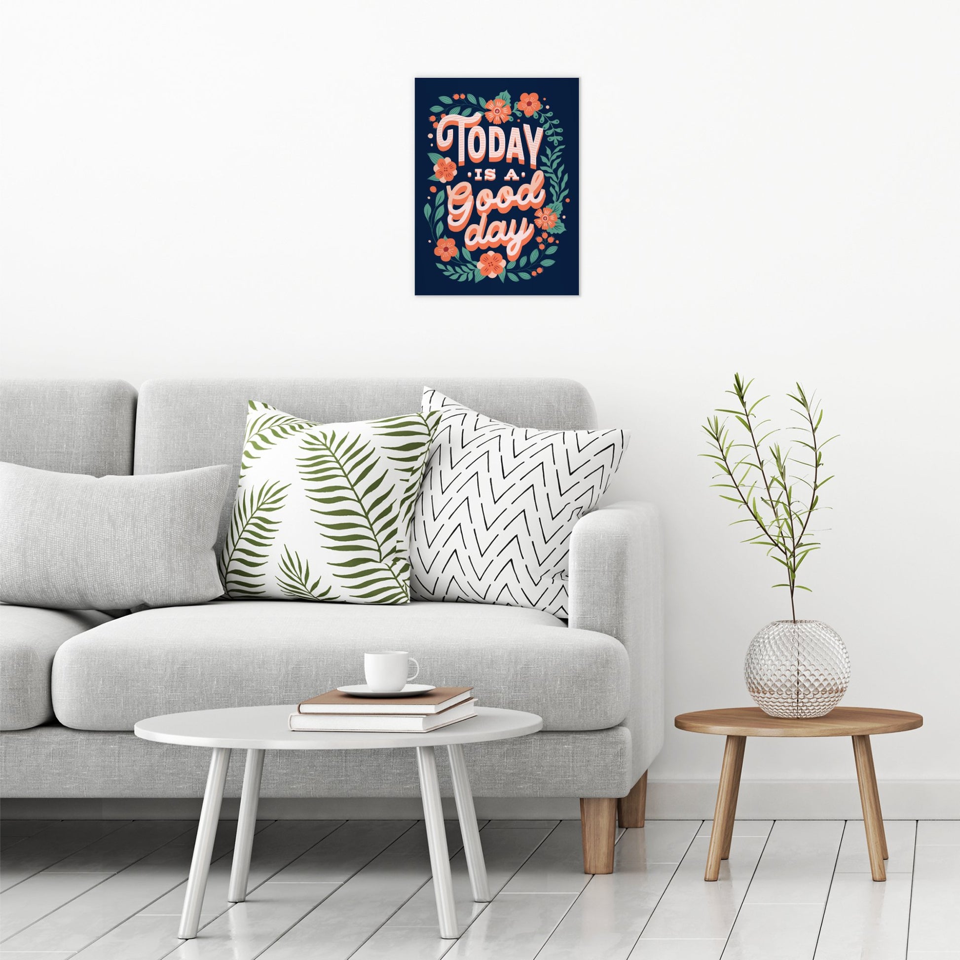 A contemporary modern room view showing a medium size metal art poster display plate with printed design of a Today is a Good Day Inspirational Quote