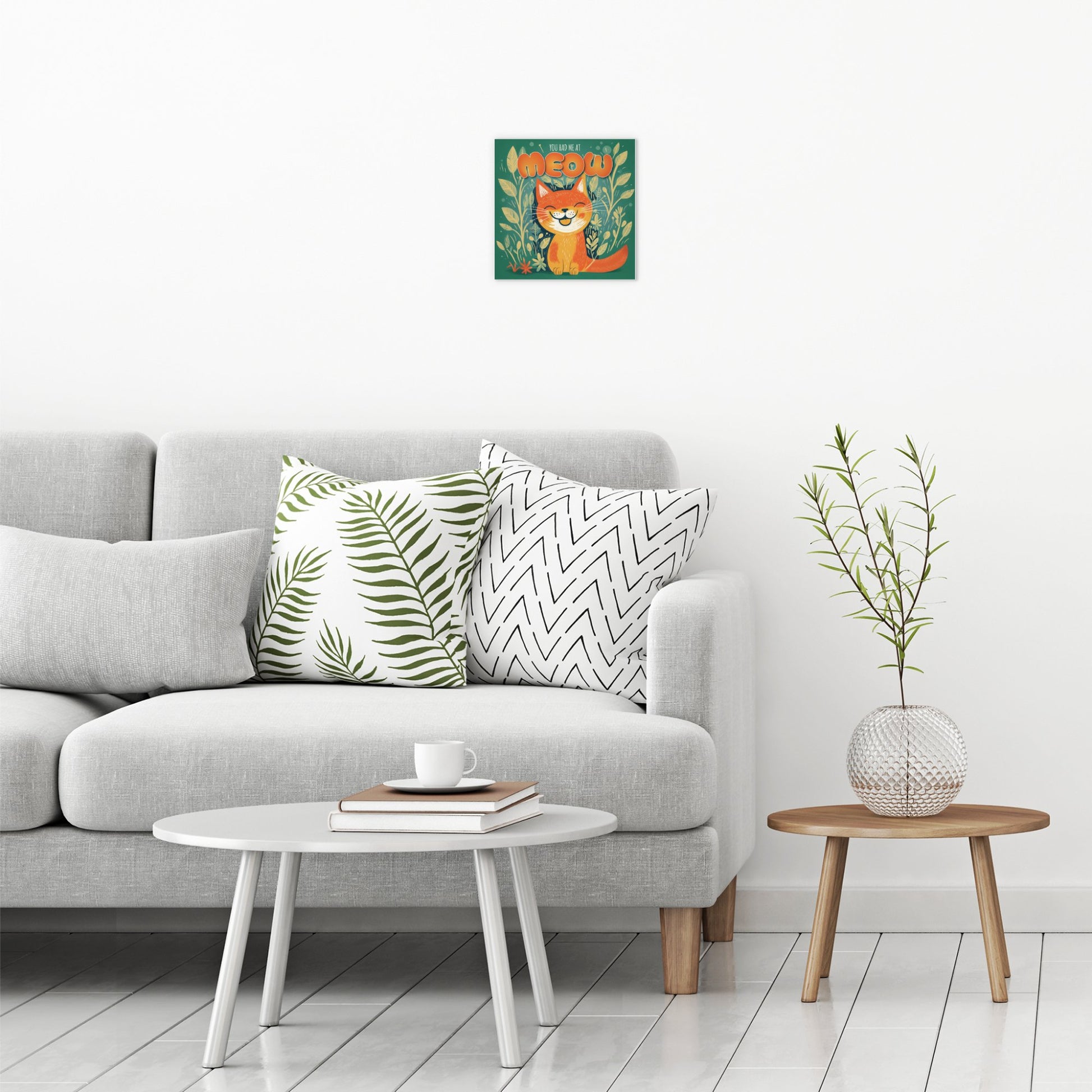 A contemporary modern room view showing a small size metal art poster display plate with printed design of a You Had Me At Meow - Cute Cat Quote