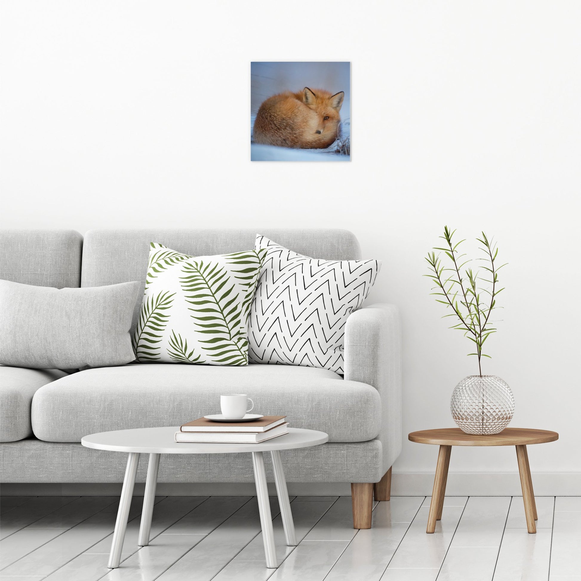 A contemporary modern room view showing a medium size metal art poster display plate with printed design of a A Cute Fox in the Snow
