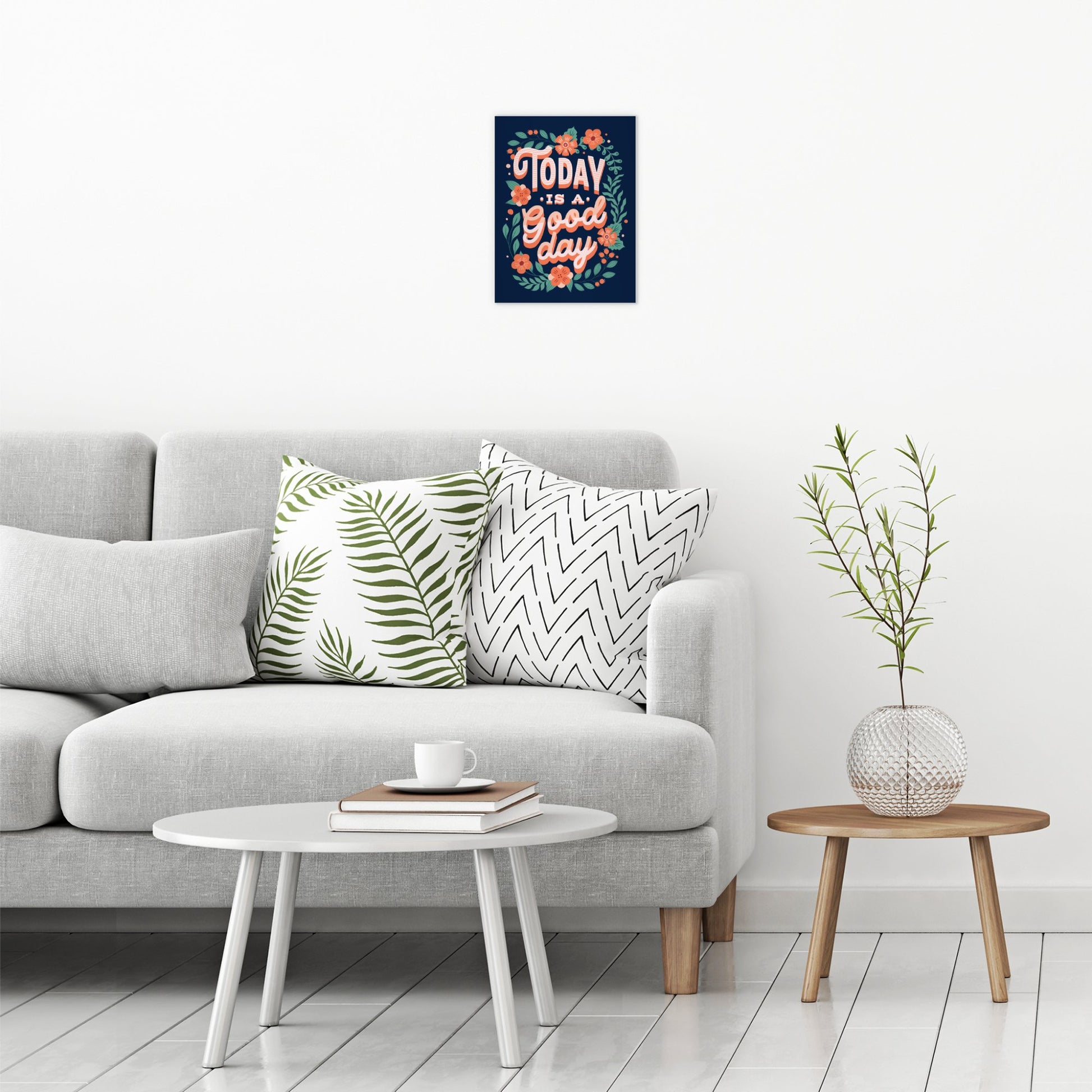 A contemporary modern room view showing a small size metal art poster display plate with printed design of a Today is a Good Day Inspirational Quote