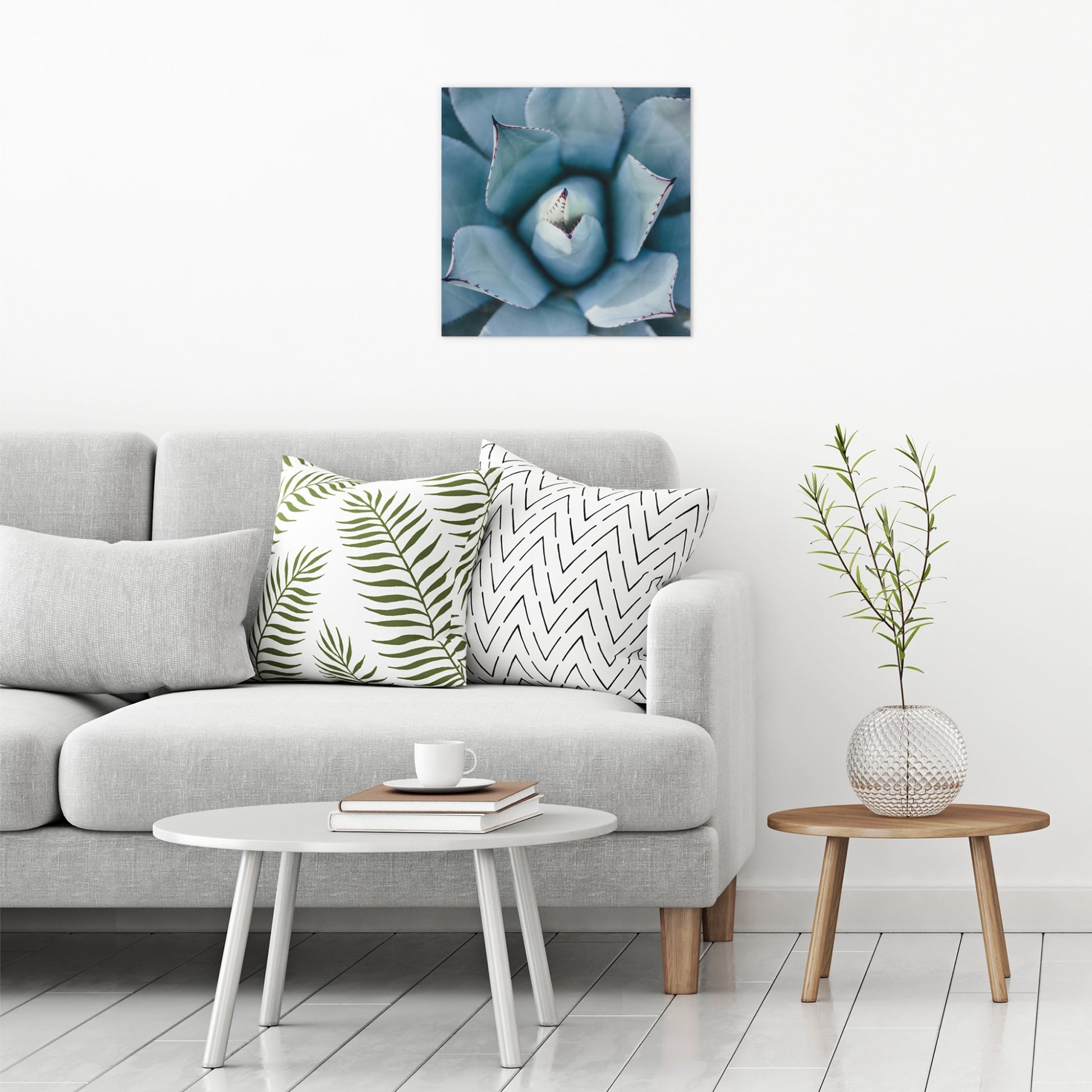 A contemporary modern room view showing a large size metal art poster display plate with printed design of a Blue Succulent