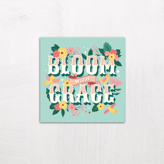 A medium size metal art poster display plate with printed design of a Bloom with Grace Inspirational Quote