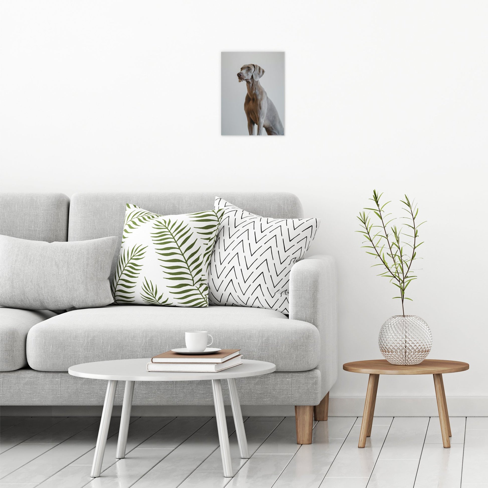 A contemporary modern room view showing a small size metal art poster display plate with printed design of a Weimaraner