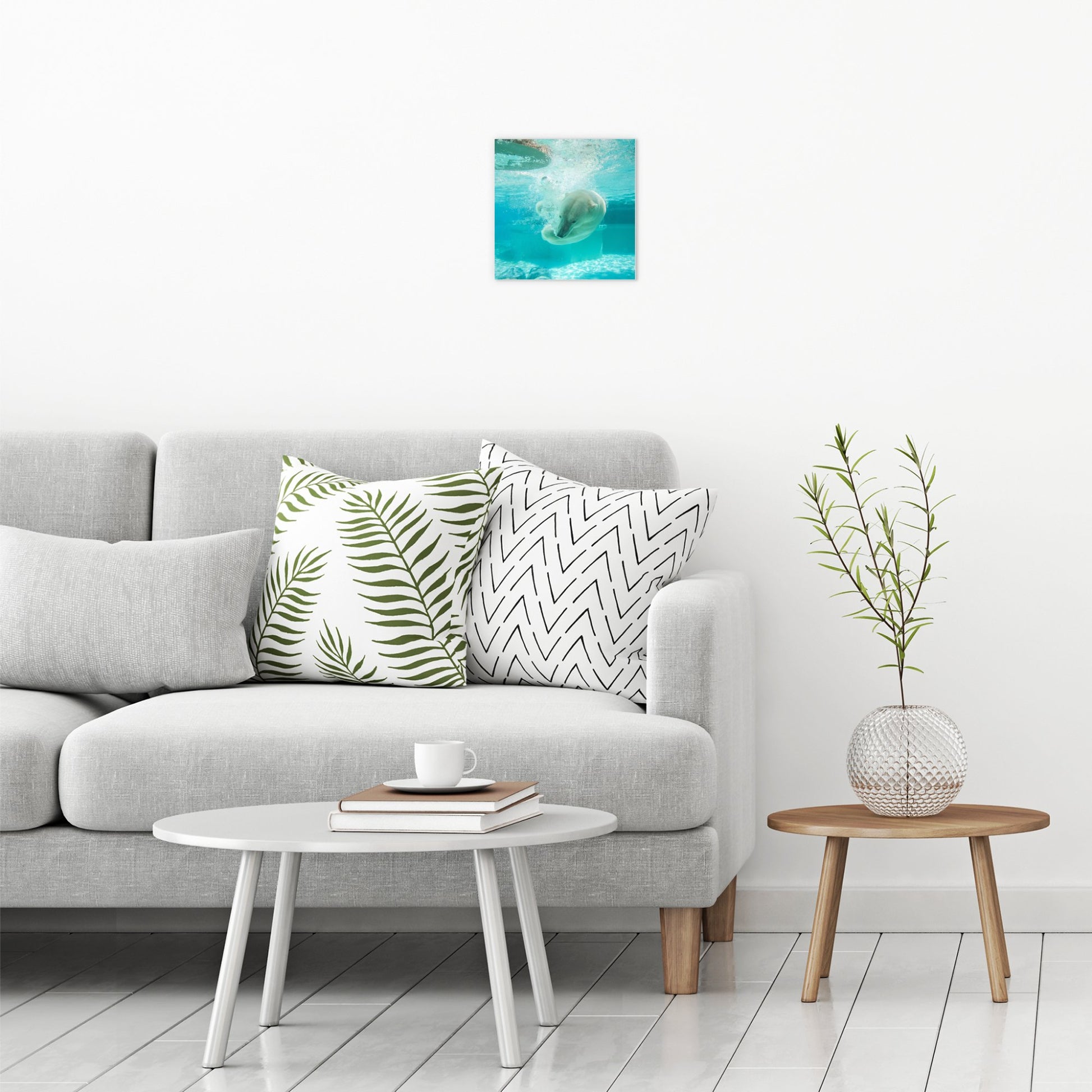 A contemporary modern room view showing a small size metal art poster display plate with printed design of a Polar Bear Under Water