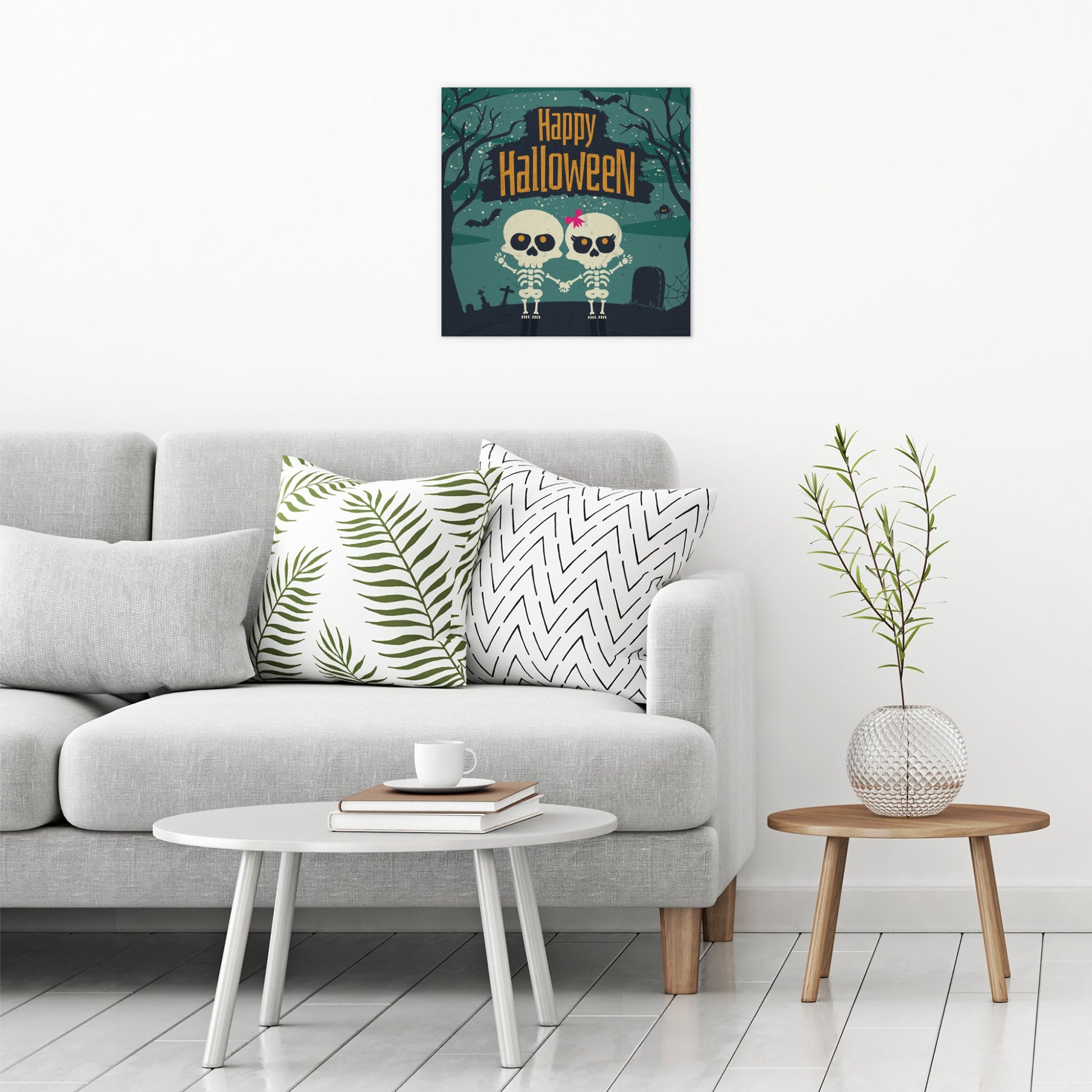 A contemporary modern room view showing a large size metal art poster display plate with printed design of a Happy Halloween Cute Skeletons